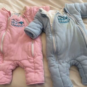 Two baby Merlin's Magic Sleepsuit in Pink and blue